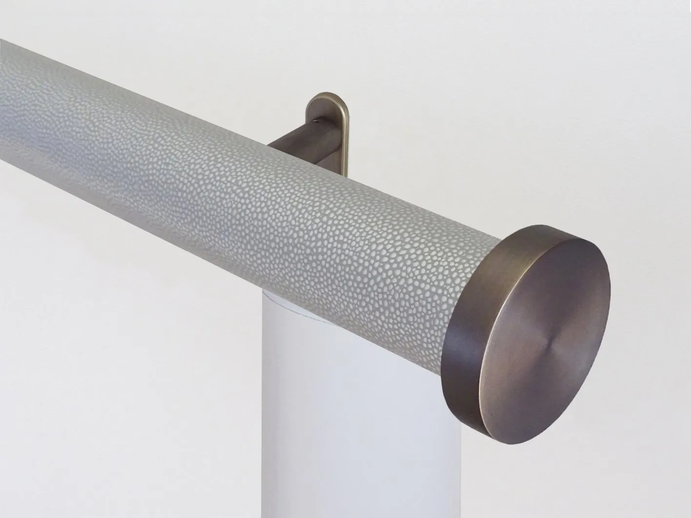 Motorised curtain pole in 50mm dia. pebble wrap