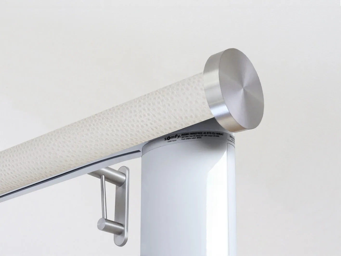 Motorised curtain pole set in 50mm dia. ostrich wrap with mini disc finials