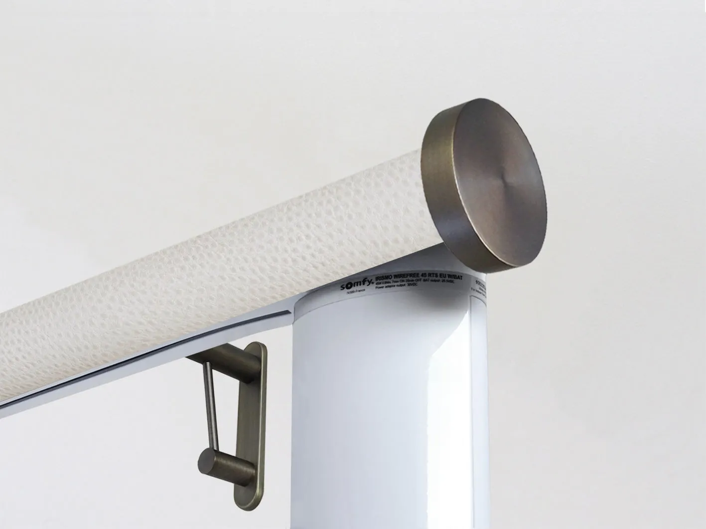 Motorised curtain pole set in 50mm dia. ostrich wrap with mini disc finials
